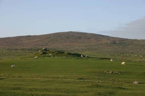 Fig. H2.11. The dun from the south west, with signs of cultivation extending almost to the summit of Beinn a' Chàrnain in the background (J Hooper) - click for a larger image
