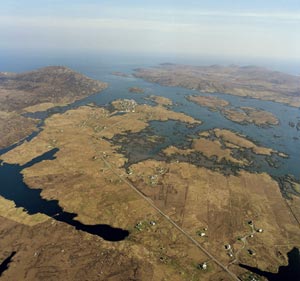 Fig. H3.1. Aerial view looking south-east over Loch Boisdale/Baghasdail with the two Pabaigh islands in centre foreground (SC 1009336, taken 24 April 2005. Crown Copyright: RCAHMS) - click for a larger image