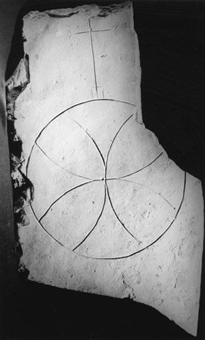 O2.4 An incised compass-drawn cross from St. Boniface's, dating to the late seventh or early eighth century (NMS) - click for a larger image